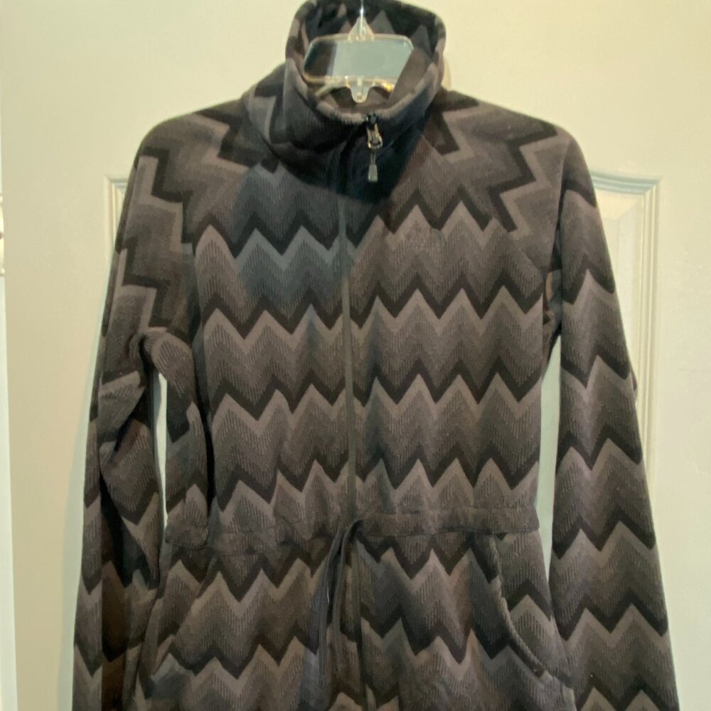 The North Face Women's Zip Up Chevron Print Jacket with a cinched waist.